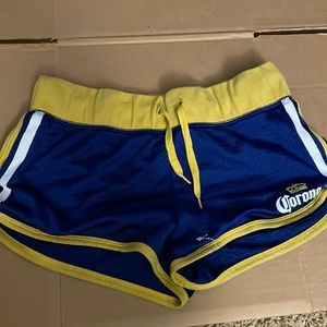 Corona Beer, blue and yellow woman’s shorts